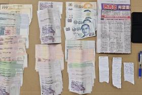 Cash, a mobile phone and gambling paraphernalia were seized in a police enforcement operation on March 17, 2024. 