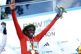 FILE PHOTO: Athletics - Berlin Marathon - Berlin, Germany - September 24, 2023 Kenya's Eliud Kipchoge celebrates on the podium with his medal after winning the Berlin Marathon REUTERS/Lisi Niesner/File Photo