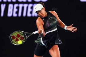 FILE PHOTO: Jan 15, 2024; Melbourne, Victoria, Australia; Naomi Osaka of Japan plays a shot against Caroline Garcia (not pictured) of France in Round 1 of the Women&#039;s Singles on Day 2 of the Australian Open tennis at Rod Laver Arena./Mike Frey-USA TODAY Sports/File Photo