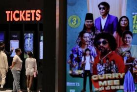 People buy movie tickets from a movie ticket kiosk at a cinema in Kuala Lumpur, Malaysia January 30, 2024. REUTERS/Hasnoor Hussain