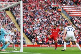 Liverpool&#039;s Mohamed Salah misses a chance to score.