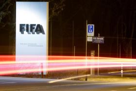 FILE PHOTO: A long exposure shows FIFA's logo near its headquarters in Zurich, Switzerland February 27, 2022. REUTERS/Arnd Wiegmann/File Photo