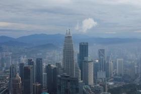 FILE PHOTO: A general view of city skyline including Malaysia's landmark Petronas Twin Towers in Kuala Lumpur, Malaysia February 3, 2023. REUTERS/Hasnoor Hussain/ FILE PHOTO