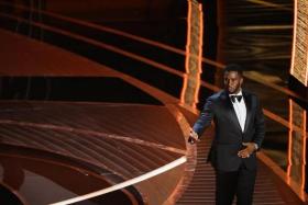 FILE PHOTO: Sean \"Diddy\" Combs speaks to the audience at the 94th Academy Awards in Beverly Hills, California, U.S., March 27, 2022. REUTERS/Brian Snyder/FILE PHOTO