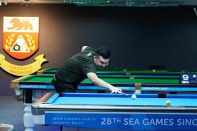 SEA games gold medalist Aloysius Yapp playing in a local nine-ball pool tournament held at the Cuesports Singapore Academy.