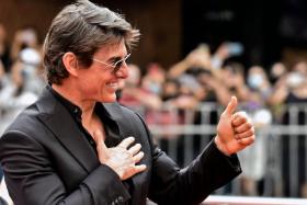 Tom Cruise gives the thumbs up as he arrives for the premiere of Top Gun: Maverick in Mexico.