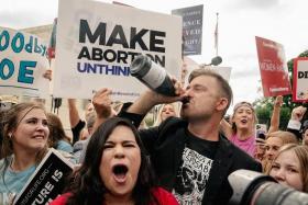 Anti-abortion demonstrators celebrate outside the Supreme Court in Washington.