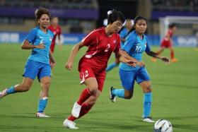 Singapore's women's football team (blue) were outclassed twice by North Korea at the Asian Games. They lost the first game 7-0 and the second 10-0 on Wednesday.
