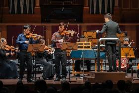 TwoSet Violin&#039;s Brett Yang (left) and Eddy Chen performing under the baton of Rodolfo Barraez and with the Singapore Symphony Orchestra.