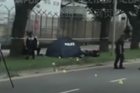 A blue tent was seen on the roadside grass verge next to a toppled motorcycle. The motorcycle is believed to have skidded. 