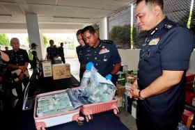 Selangor police chief Hussein Omar Khan (centre) said the police have identified seven sets of fingerprints on the bag.