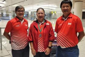(L-R) Singapore bowls coach Bernard Foo, Bronze medallist Philomena Goh, Singapore male bowls player Anthony Loh, returning from Gold Coast, Australia after competing at the World Bowls Champion of Champions.