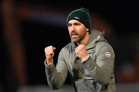 American actor and Wrexham owner Ryan Reynolds at the English FA Cup fourth-round football match between Wrexham and Sheffield United at the Racecourse Ground Stadium in Wrexham, north Wales, on Jan 29. The match ended in a draw at 3-3. 