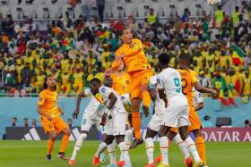 Netherlands&#039; defender Virgil van Dijk heads the ball during the Qatar 2022 World Cup Group A football match between Senegal and the Netherlands on Nov 21, 2022.