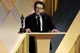 Actor Michael J. Fox accepts the Jean Hersholt Humanitarian Award at the 13th Governors Awards in Los Angeles on Nov 19, 2022. 