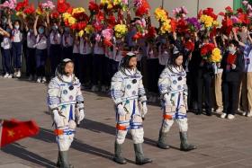 The trio blasted off in a Long March-2F rocket from the Jiuquan launch center in northwestern China&#039;s Gobi desert. 