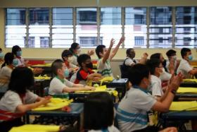 New Town Primary School pupils waiting to receive their PSLE results on Nov 24, 2021.