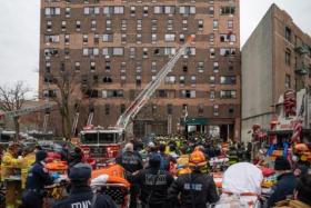 Emergency first responders at the scene after an intense fire at a 19-story residential building in the Bronx borough of New York City on Jan 9, 2022.