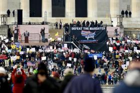 People gather on the National Mall while protesting vaccine and mask mandates, in Washington on Jan 23, 2022. 