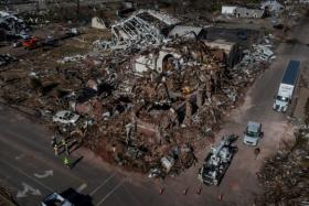 Working crews surround First Presbyterian Church in the aftermath of a tornado in Mayfield, Kentucky, US on Dec 12, 2021. 