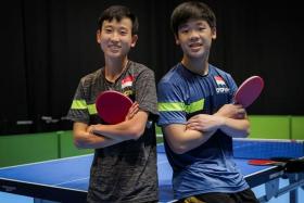 Singapore paddlers Zhou Jingyi (left) and Izaac Quek pose for pictures in Birmingham, on Aug 3, 2022.