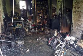 The aftermath of a fire caused by a personal mobility device charging in a living room at Block 27 New Upper Changi Road, on March 9, 2022.

