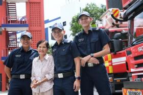 Madam Tay Bee Neo together with (from left) Special Constable Muhammad Amru bin Abd Rahman, Sergeant Tan Wei Jie and Sergeant Choong K-Ron.
