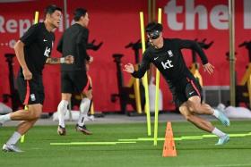 Son Heung-min (right) at a training session in Doha on Nov 22, 2022.