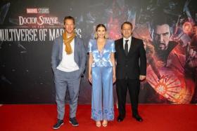 Doctor Strange In The Multiverse Of Madness actors Benedict Cumberbatch (left) and Elizabeth Olsen with director Sam Raimi.