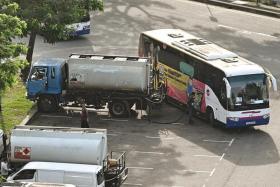 A tanker illegally dispenses fuel at Tampines North Drive 3 Heavy Vehicle Park, on Feb 24, 2023.