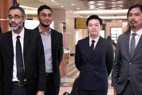 Director Khairi Anwar Jailani (second from left) and producer Tan Meng Kheng (third from left) could face a one-year jail term if found guilty.