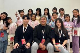 The team from local performing arts studio Maddspace in the dressing room during K-pop star IU&#039;s concert on April 21. 