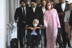 The wheelchair-bound former Malaysian finance minister Daim Zainuddin was accompanied by his wife and other family members in court. 