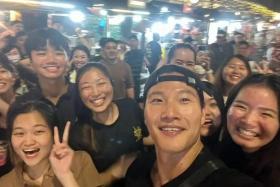 Kim Jong-kook from popular South Korean variety series Running Man takes a wefie with fans at Lau Pa Sat.