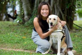 Paralympic swimmer Sophie Soon with her guide dog, Orinda. 