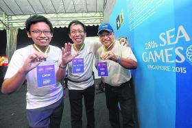 HEARTS ON THEIR TAGS: (From left) Heinrich Yin, his father Richard Yin, and Salim Suri are looking forward to doing their part as volunteers for the SEA Games next year.