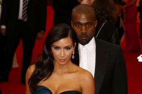 Kim Kardashian and Kanye West arrive at the Metropolitan Museum of Art Costume Institute Gala Benefit celebrating the opening of &quot;Charles James: Beyond Fashion&quot; in Upper Manhattan, New York, May 5, 2014.