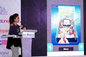 NEXT BIG THING: (Above) TNP multimedia journalist Catherine Robert introducing TNP&#039;s new app at the SPH digital launch.