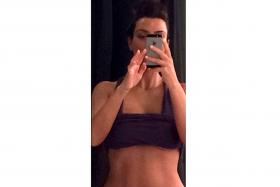 Kim Kardashian posted this sexy selfie on May 14, 2014 on Instagram with the caption: &quot;Just finished my morning workout&quot;.