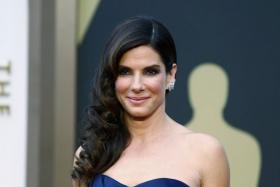 Sandra Bullock surprised New Orleans high school students at their graduation ceremony