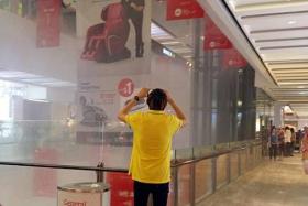 SOAKED: Shoppers at Jem were caught off-guard when a sprinkler system was suddenly activated.