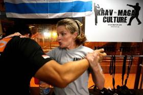 BLOCK: Mother-of-two Jennifer Jacoby has been learning the Israeli form of self-defence for the past five years.  