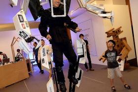 Mr Tomohiro Aka doing a demonstration in the 2nd Generation Skeletonic exoskeleton suit.