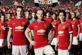 Man United players model their club&#039;s last home shirt from Nike for the 2014/15 season. 