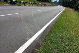 SLIP: The skid marks left behind by the minibus before it veered to the side of the road. 