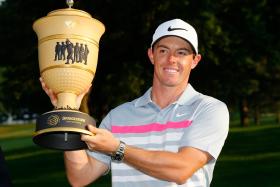Rory McIlroy of Northern Ireland holds the Gary Player Cup trophy after winning the World Golf Championships-Bridgestone Invitational on Aug 3 in Akron, Ohio. 