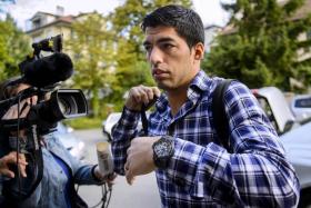 Luis Suarez arrives at the Court of Arbitration for Sport in Lausanne, Switzerland to appeal against his ban for biting Giorgio Chiellini at the 2014 World Cup. 