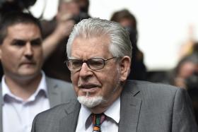 Two players at Australian Rules team Melbourne Demons will be punished by the club after dressing up as disgraced children’s entertainer Rolf Harris and a young girl during their “Mad Monday” celebrations. 