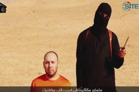 The Islamic State released a video purporting to show the beheading of Sotloff, a monitoring service said on Tuesday, as the militant group raised the stakes in its confrontation with Washington over U.S. air strikes on its fighters in Iraq. 
