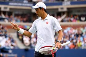 Kei Nishikori of Japan gestures against Marin Cilic of Croatia during their men's singles final match at the 2014 US Open. 